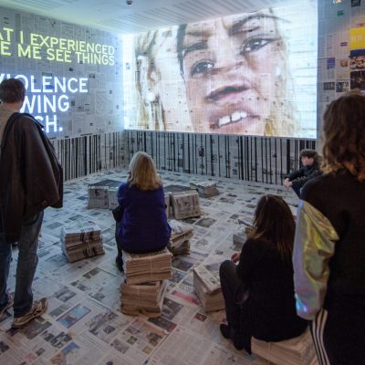 SCAR, an audiovisual installation bringing new perspectives to violence against women. Based on an academic research with over 800 women who live in Maré, Rio de Janeiro’s largest favela complex, Scar was created by Brazilian artist Bia Lessa (blue top/chequed scarf) presenting the stories of 20 women both as unique individuals and as part of a collective expression of resistance, 2 of them Maria Alice Vieira and Gilmara Cunha (big earrings) where at the opening of the exhibition in London. Photo by Andre Camara